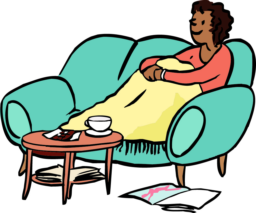 Eine Frau sitzt gemütlich auf einem Sofa Eine Frau sitzt auf einem Sofa.